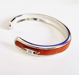 Zilveren cuff armband met leer